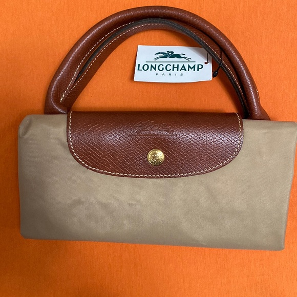 Longchamp Handbags - COPY - Longchamp vintage original handbag Le Pliage WITH HANDLE
Cognac Recycled…